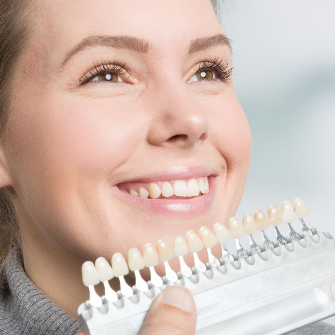 Women smiling during appointment for veneers