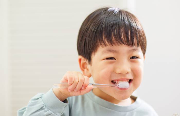 boy brushing his teeth